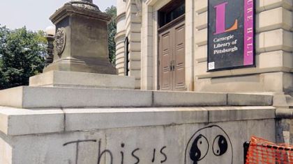 Graffiti vandals have tagged two quotes on the side of the Carnegie Library in Oakland.