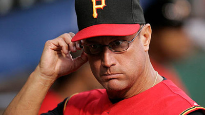 Pirates manager John Russell watches a 3-1 loss to the Milwaukee Brewers last night.