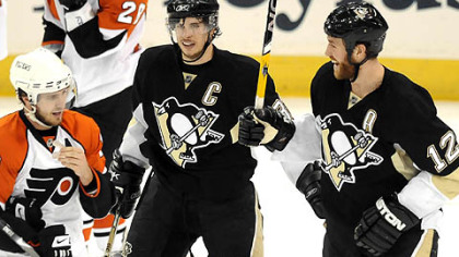 Penguins Ryan Malone celebrates his second period goal with teammate Sidney Crosby Sunday.