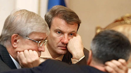 MOSCOW-- The head of the Central Bank, Sergei Ignatiev, left, and Russia's Sberbank German Gref officials attend a meeting on the growing domestic and global economic crisis. Russian President Dmitry Medvedev pledged credit, equivilent to up to 36 billion US dollars, to support the country's banks.