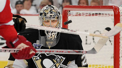 Penguins goalie Marc-Andre Fleury makes save on Red Wings Johan Franzen.