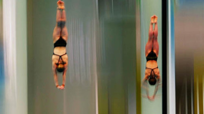 Briony Cole and Melissa Wu compete for Australia in the women's synchronized 10 meter platform final.