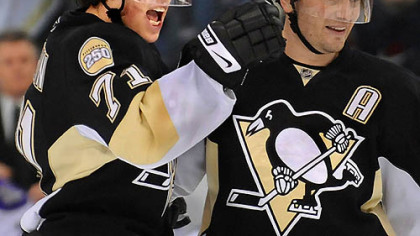 Evgeni Malkin celebrates the first of his two goals with Sergei Gonchar yesterday in the Penguins' win.