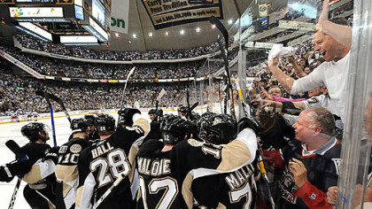 The Penguins celebrate after Marian Hossa's overtime goal against the Rangers yesterday at Mellon Arena.