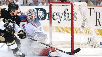 Sidney Crosby misses a scoring chance in the first period.