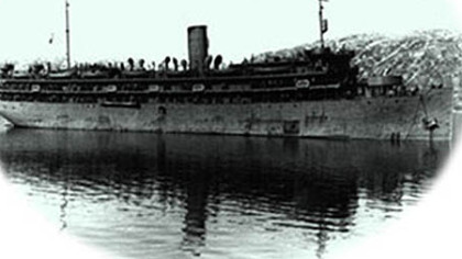 The Dorchester, shown here in Greenland, was converted from a cruise ship and carried 900 men when it was torpedoed by a German submarine in the North Atlantic.