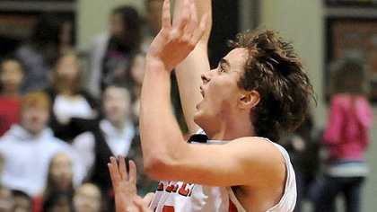 Sewickley Academy's Tom Droney scores against Quigley last night in thier Class A contest. Sewickley Academy won 73-32.