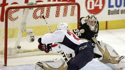 The Capitals' Alexander Semin shoots the puck past Penguins goalie Ty Conklin in the shootout to give the Capitals a 6-5 win last night.