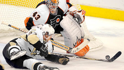 Flyers goalie Martin Biron stops Sidney Crosby.