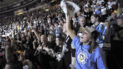More than 13,000-plus who showed up at Mellon Arena to watch the game on the scoreboard video screens.
