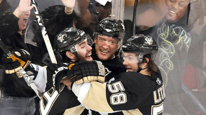 Penguins Marian Hossa is congratulated by teammates Pascal Dupuis and Kris Letang after scoring the winning goal in overtime to beat the Rangers.
Please click top image name to left for full gallery.