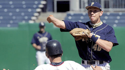 Pitt's Philip Konieczny attempts to turn a double play in the face of Duquesne runner Dante Plassio yesterday at PNC Park. Konieczny also knocked in five runs in the Panthers' romp.