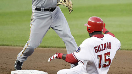 Washington Nationals Cristian Guzman (15) is forced out at second by Pittsburgh Pirates Freddy Sanchez, left, during the first inning of an MLB baseball game, Thursday in Washington. Nationals Ryan Zimmerman (not shown) was safe at first on the play.