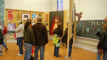 Visitors look at artwork in the Catalyst Building during last year's Art All Night Lawrenceville.