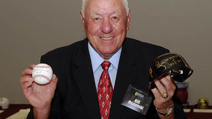 Bill Mazeroski holds an autographed ball and Pittsburgh Pirates helmet to be auctioned at the Dapper Dan Dinner at the David L. Lawrence Convention Center last night. He received the award for the all time greatest sports moment for his legendary home run blast that won the Pirates the 1960 World Series.