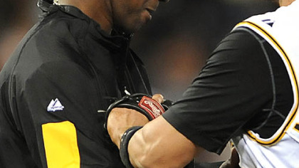 Doug Mientkiewicz congratulates winning pitcher Yoslan Herrera last night at PNC Park.