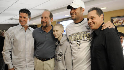 John Challis poses for a photo with Penguins owner Mario Lemieux, Atlanta Braves pitcher John Smoltz, Steelers quarterback Ben Roethlisberger and ex-Penguins star Pierre Larouche during the Penguins game against the Flyers on May 11.