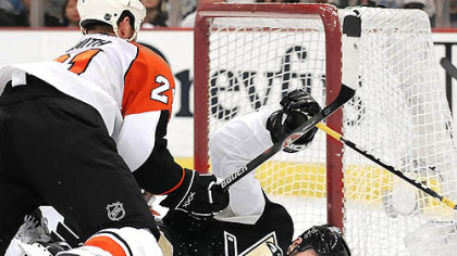 Penguins Ryan Malone tripped by Flyers Jason Smith in the third period during the final regular season game at the Mellon Arena, Pittsburgh Pa.