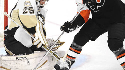 Marc-Andre Fleury makes one of his 17 saves.