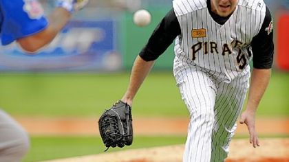 Zach Duke comes off the mound to field a bunt by Chicago's Henry Blanco in the seventh inning yesterday at PNC Park.