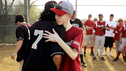 Freedom's John Challis gets a hug from Beaver's Al Torrence after a game April 24.