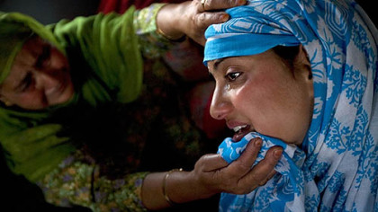 SRINAGAR, India -- Relatives of Shafar Ahmad Matoo mourn his death after he was allegedly shot by Indian forces during a civil demonstration to protest a visit by the Indian Prime Minister Manmohan Singh who was in the region to inaugurate its first train line.