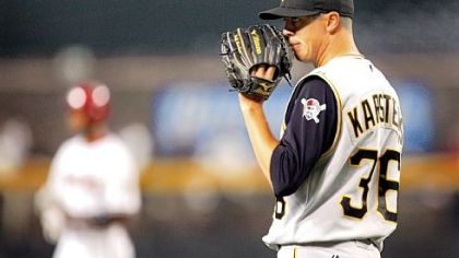 Jeff Karstens waits for the baseball after Arizona's Chris Young broke up his perfect game with two outs in the eighth inning at Chase Field.