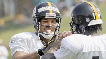 Hines Ward jokes with teammate Santonio Holmes.