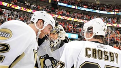 Ryan Malone and Sidney Crosby celebrate with Marc-Andre Fleury after beating the Senators in the series, 4-0, Wednesday in Ottawa.
