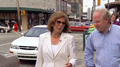 Teresa Heinz Kerry and Carl Kurlander stroll the Strip District in "My Tale of Two Cities," Kurlander's film about his return to his hometown.