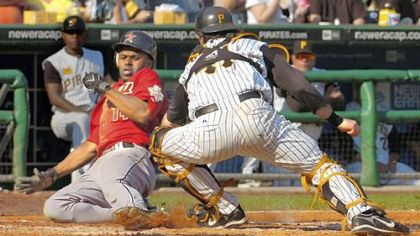 Houston's Michael BournHouston's Michael Bourn slides home as Pirates catcher Ryan Doumit tries to make the tag. Bourn was safe on the play as the Astros rolled to a 6-2 victory.