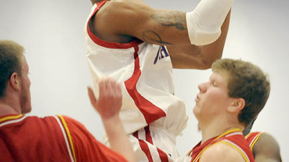 Jeannette's Terrelle Pryor drives against North Catholic in yesterday's Class AA quarterfinal at Hempfield High School.
