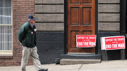 Marty O'Malley, a Forest Hills council member and Vietnam veteran, paces outside the Downtown office of U.S. Rep. Mike Doyle on Thursday.  He was waiting for an anti-war petition that he planned to present to the congressman's office, but the person with it did not show.