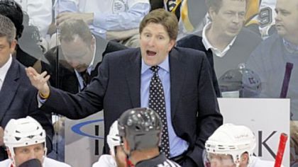 Red Wings coach Mike Babcock, top, appeals to referee Paul Devorski in the first period of Game 3 of the Stanley Cup final Wednesday at Mellon Arena.