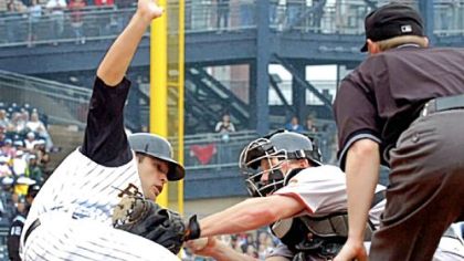 Freddy Sanchez scores ahead of a tag by Giants catcher Steve Holm in the third inning yesterday at PNC Park.