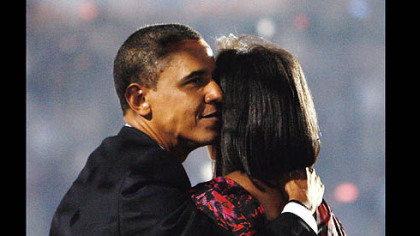 DENVER -- Following his acceptance speech, Democratic presidential nominee, Sen. Barack Obama, hugs his wife Michelle on stage at the Democratic National Convention at Invesco Field.
