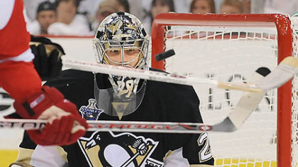 Penguins goalie Marc-Andre Fleury makes save on Red Wings Johan Franzen in the second period of Game 3 at the Mellon Arena. His performance tonight may prove crucial to the Penguins' prospects.