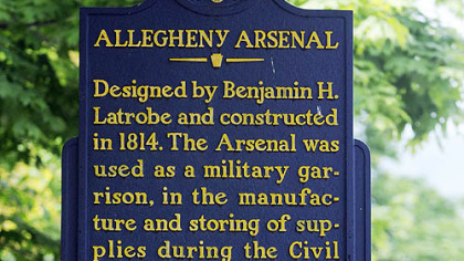 Allegheny Arsenal Historical Marker with the Arsenal Park in the background in Lawrenceville.