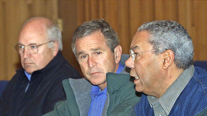 President Bush, center, listens as Secretary of State Colin Powell, right, speaks during a meeting with his Cabinet and advisers to decide on appropriate measures to respond to the terrorist attacks in New York and Washington, in this Sept. 15, 2001, photo at Camp David, Md. At left is Vice President Dick Cheney. The response is a major part of a two-part "Frontline" documentary about President Bush, called "Bush's War," which premieres on WQED tonight.