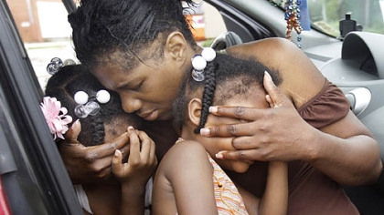 SLIDELL, La. -- Debra Peterson comforts her granddaughters as they wait in their car to return to New Orleans. Peterson and her grandchildren evacuated New Orleans to escape Hurricane Gustav.