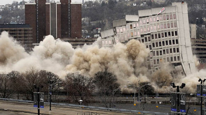 St. Francis Central Hospital collapsed around 2:15 p.m. after a series of about 15 charges detonated throughout the building yesterday.