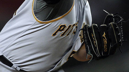Pitcher Matt Capps throws against the Los Angeles Dodgers in the ninth inning, silencing any chance of a Dodgers reply.