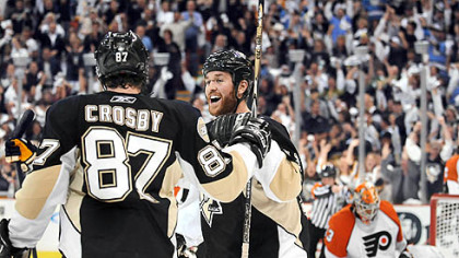 Penguins Ryan Malone celebrates with Sidney Crosby after Crosby scores in the first period.