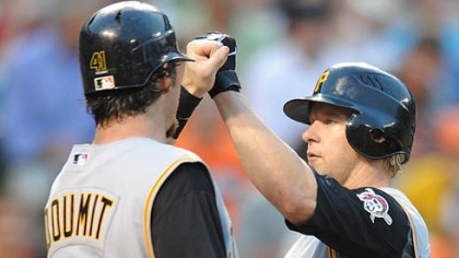 Jason Michaels is congratulated by Ryan Doumit after Michaels' 3-run homer gave the Pirates a 6-1 lead.