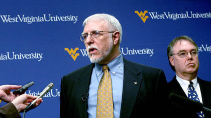 University leaders speaking to reporters yesterday at West Virgnia University included WVU Provost Gerald Lang, left, and business school dean Steve Sears.