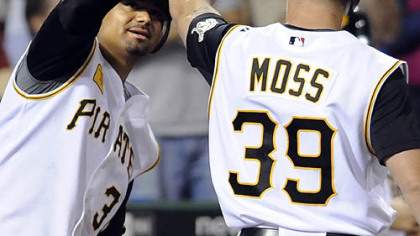 Luis Rivas, left, congratulates Brandon Moss after Moss hit his first home run at PNC Park as a member of the Pirates, connecting in the eighth inning last night.