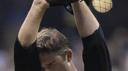 Paul Maholm wipes his head after walking-in two runs during the fourth inning  against the Brewers last night at Miller Park.
