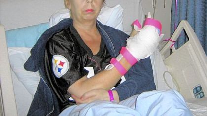 Patricia "Trish" Boyle shows her injured hand.