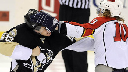 Tyler Kennedy and Florida's David Booth go head-to-head in the first period Monday night.