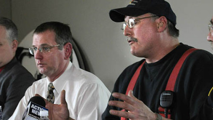 Brockway Mayor William Hrinia, left, and Fire Chief Chris Benson discuss the fatal fire in which 10 people died.
